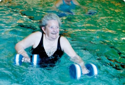 Older woman exercising in a swimming pool