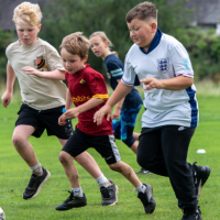 a group of young people playing football
