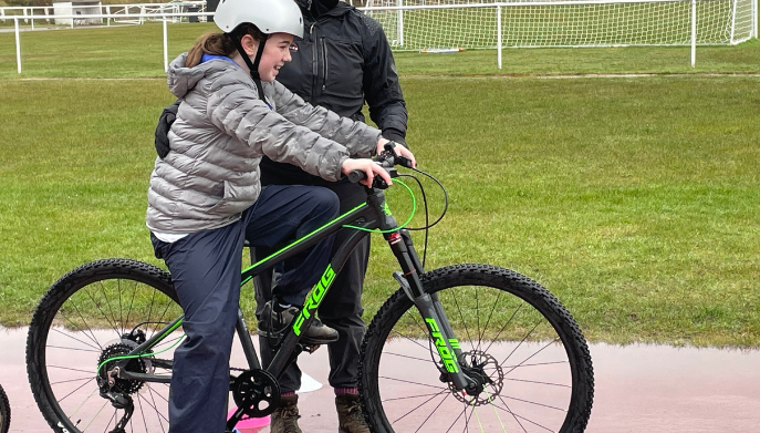 A young girl on a bike