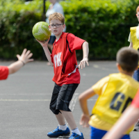 A group of young people playing netball