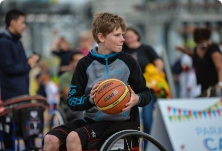 Young man playing wheelchair basketball
