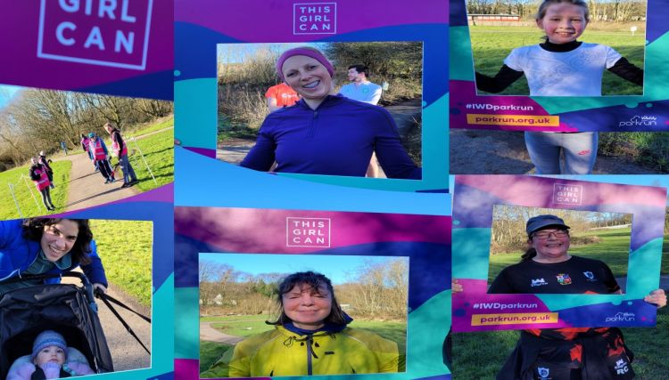 ladies looking through a selfie frame after taking part in a park run 