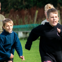 Young boys running outdoors